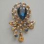 Broche-colgante Acento con cristal azul